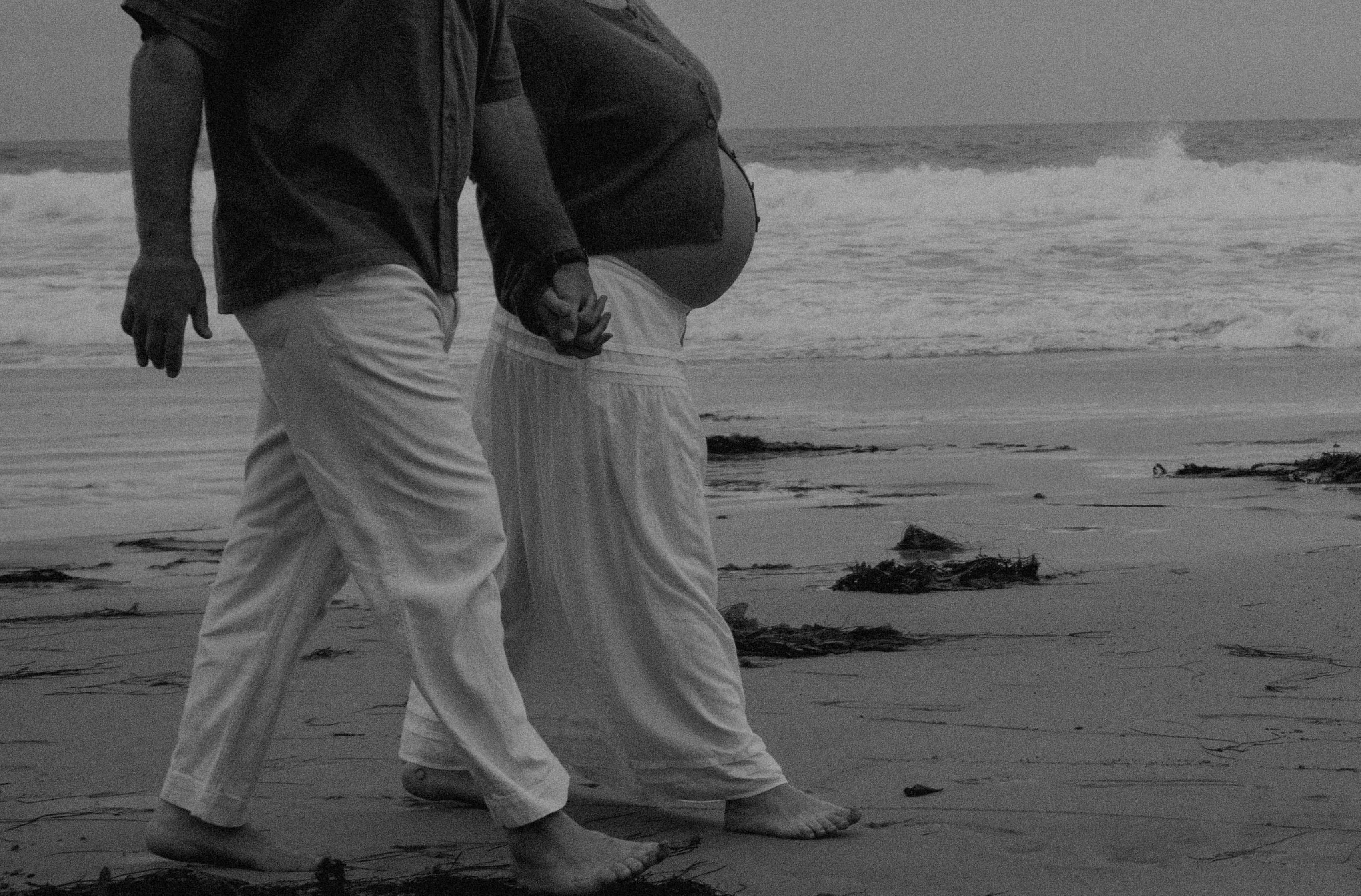 Alexandra and Andrew walking on the beach
